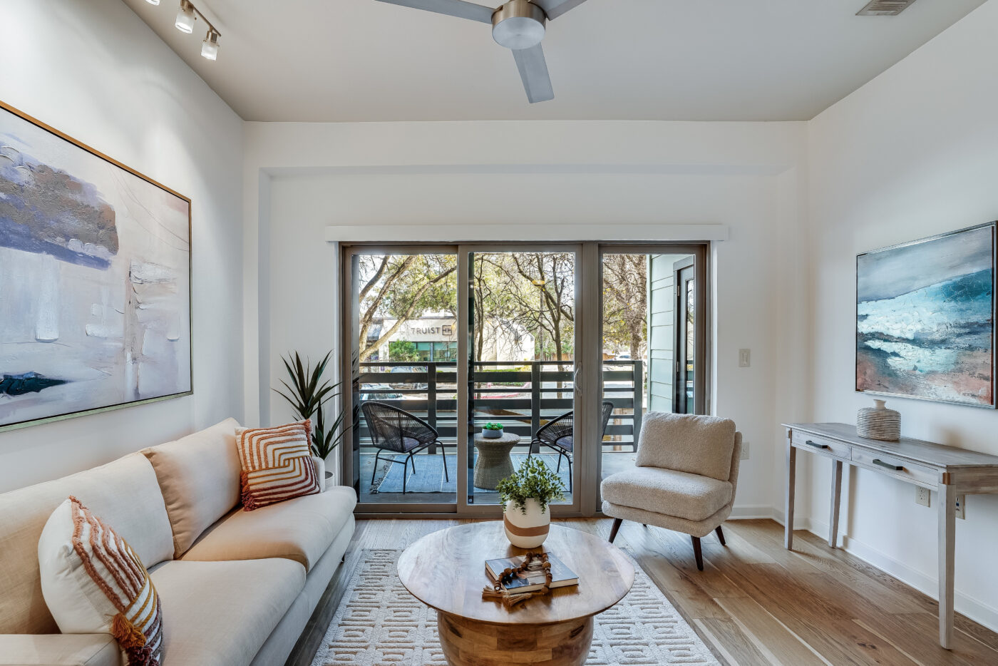 Spacious first-floor 2-bedroom condo in South Austin with a private balcony, resort-style infinity-edge pool overlooking the Greenbelt, rooftop lounge with downtown skyline views, and modern interior with fresh updates.